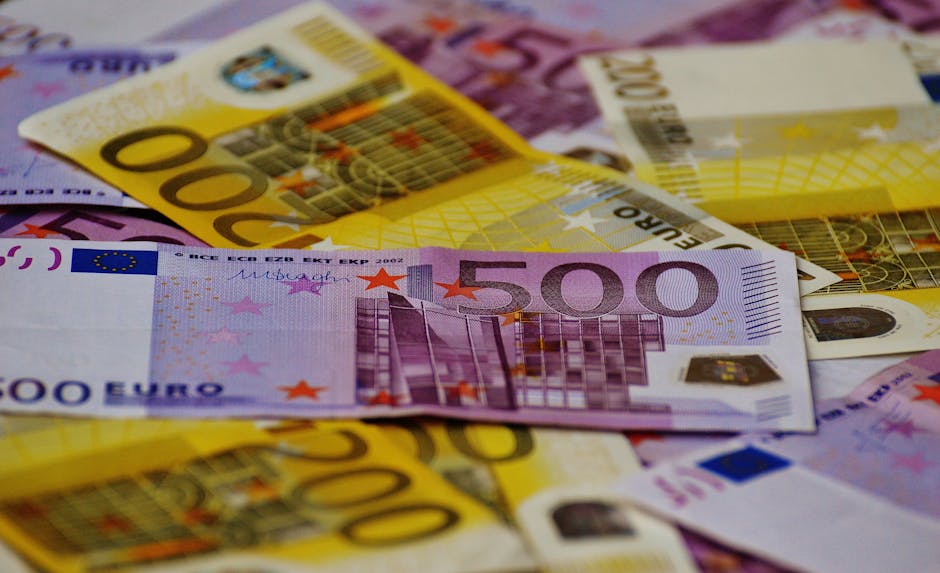 A close-up image of several Euro banknotes